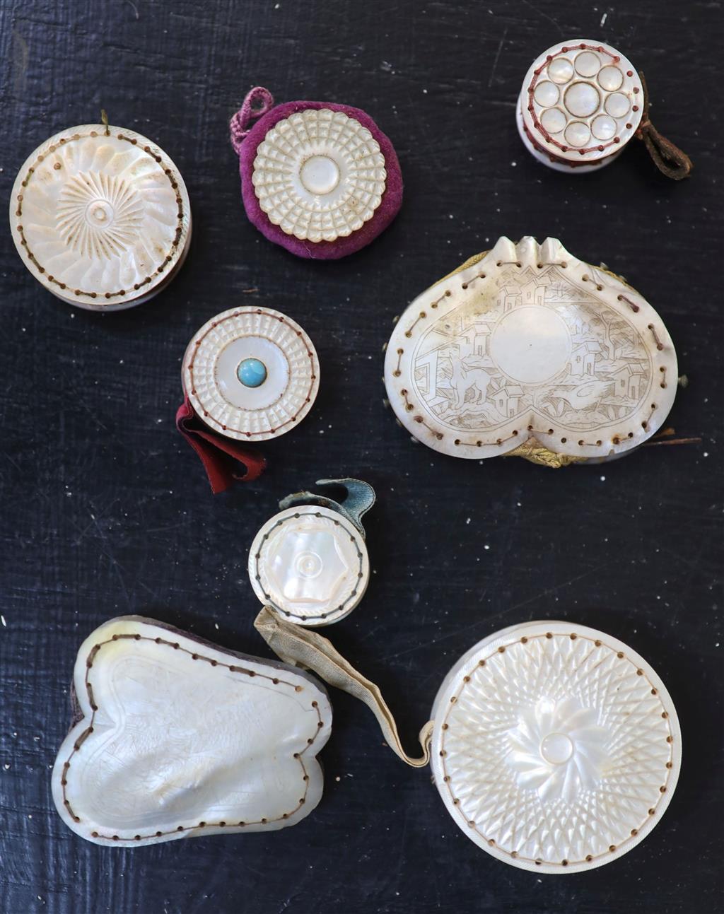 Eight assorted 19th century mother of pearl mounted pin cushions